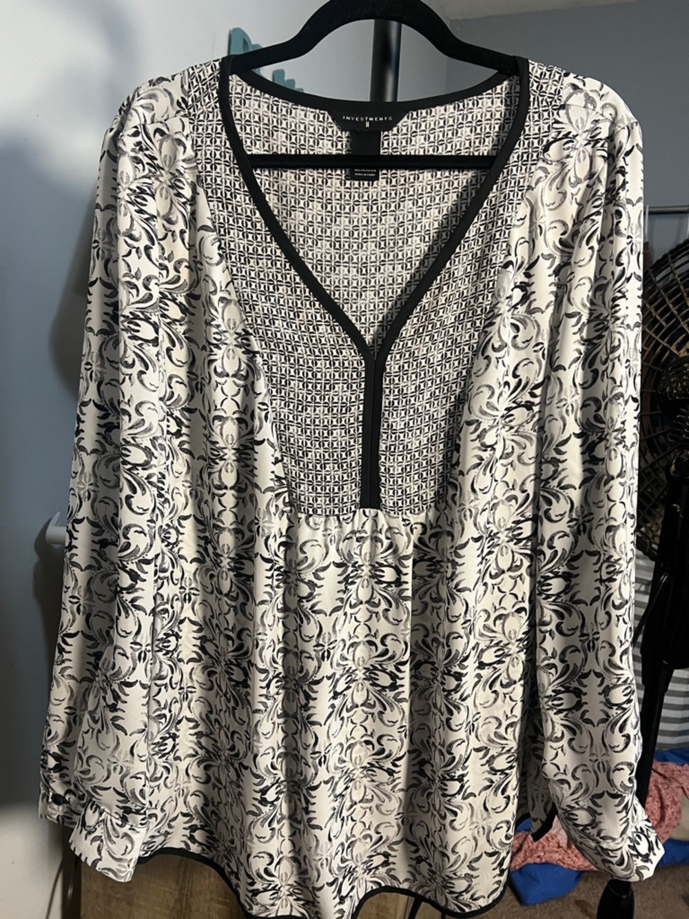 blouse black and white paisley-style pattern with a geometric print V-neckline